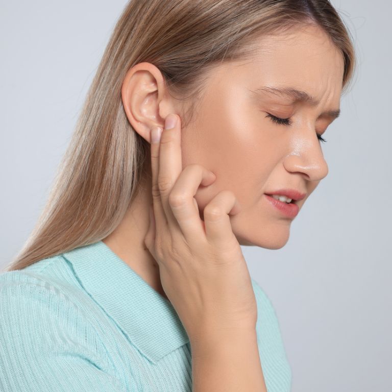 Image of a woman with ear pai